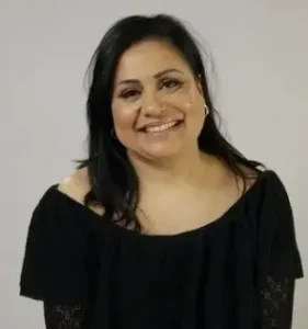 Headshot of a smiling woman with black hair.