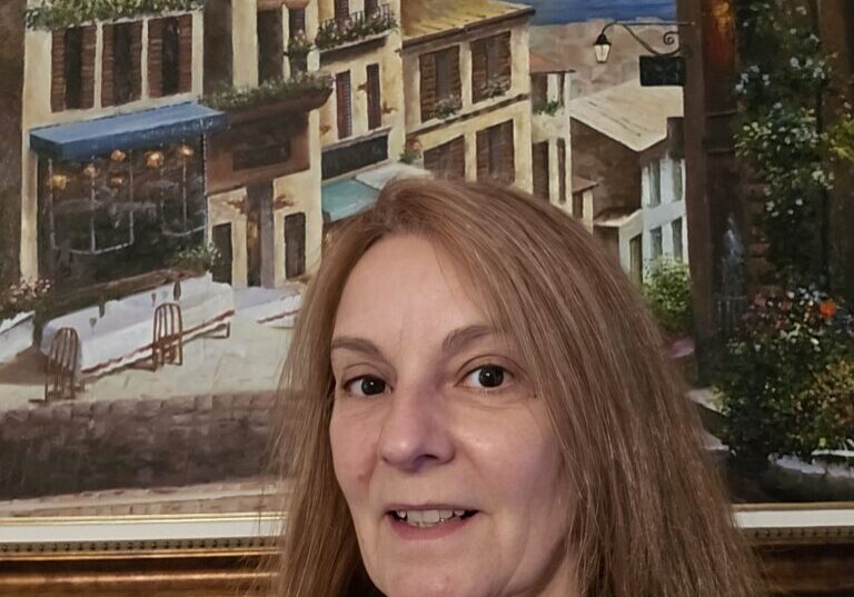 Dia 2024 Woman smiling near Italian cityscape painting.