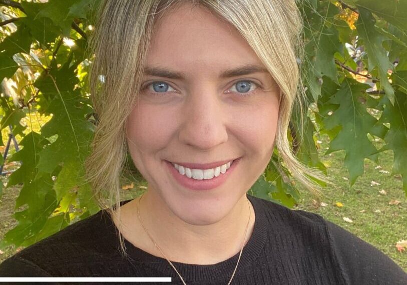 Smiling woman with blonde hair, Three Oaks logo.