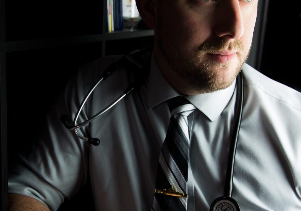 Neil (Nursing Profile) 1 to 1 2024 Man with stethoscope wearing a tie.